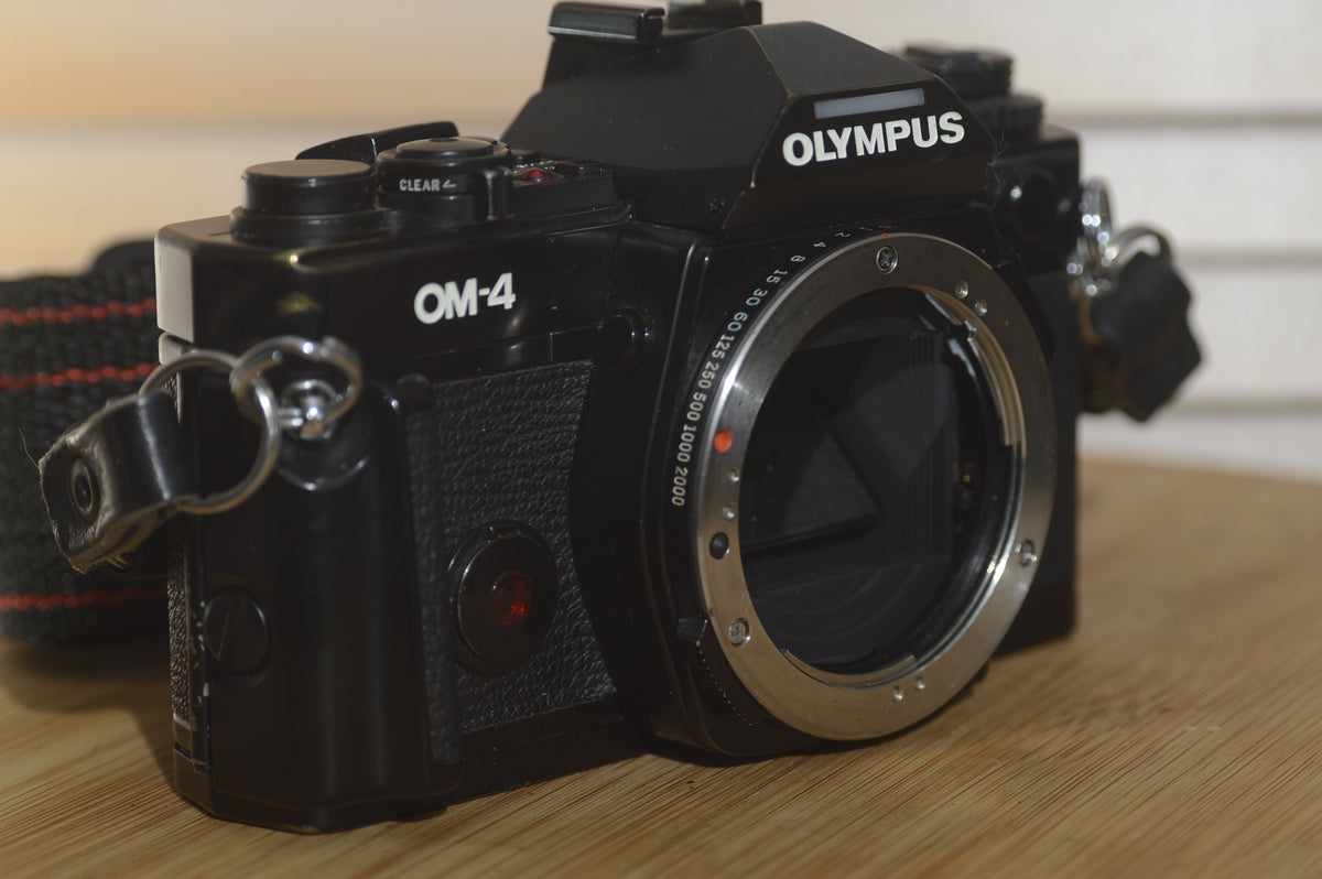 Black Olympus OM4 SLR Camera Body With Olympus Strap. In Fantastic