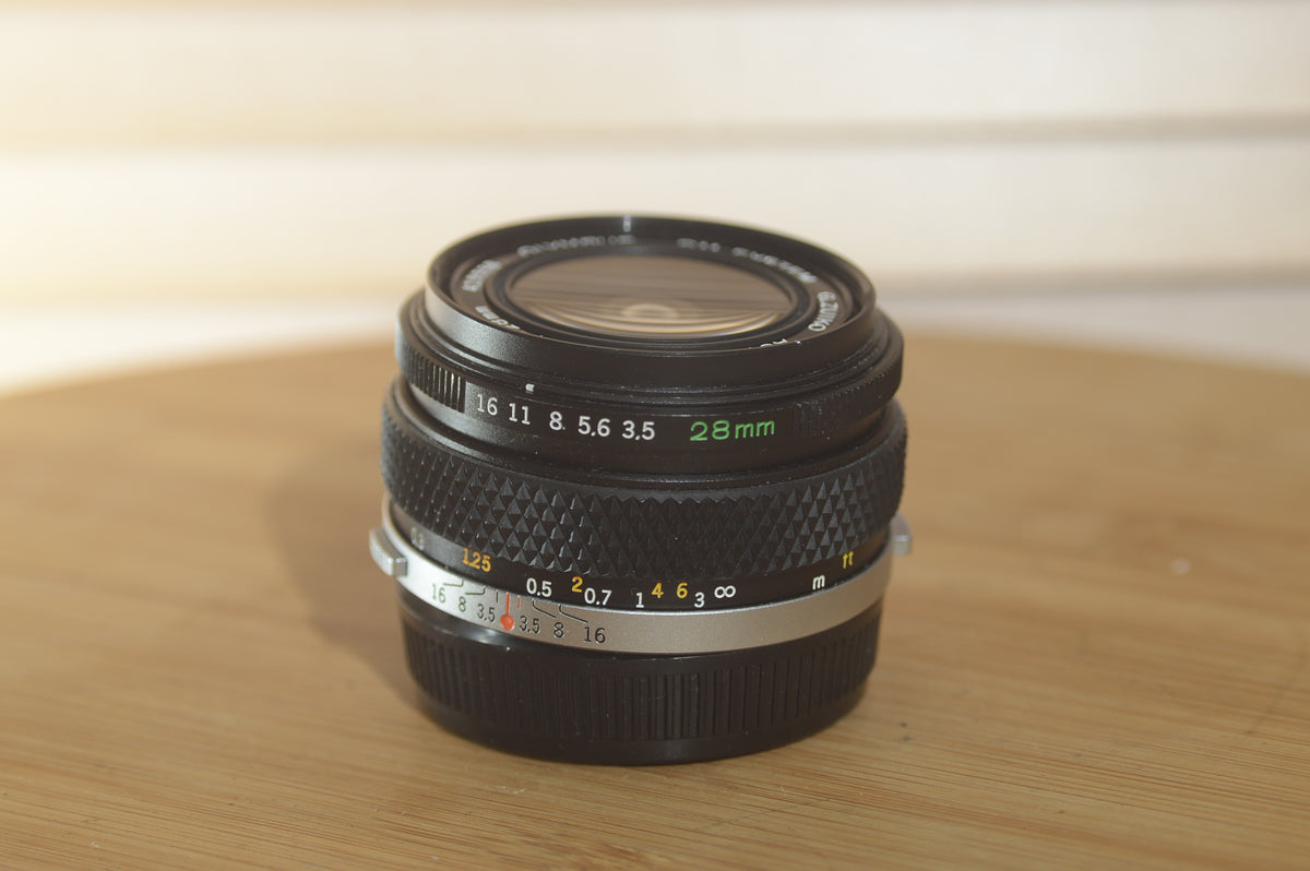 Gorgeous Olympus 28mm f3.5 Zuiko Lens. A perfect addition to your vint