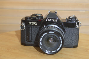 Rare Black Canon AV1 35mm SLR Camera With 28mm f2.8 Lens. Fantastic condition Starter Camera