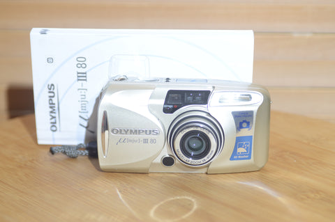 Vintage Olympus Mju 3 80 35mm compact camera with original manual.