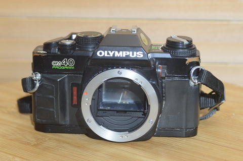 Vintage Black Olympus OM40 programme 35mm SLR (body only).  Great condition.