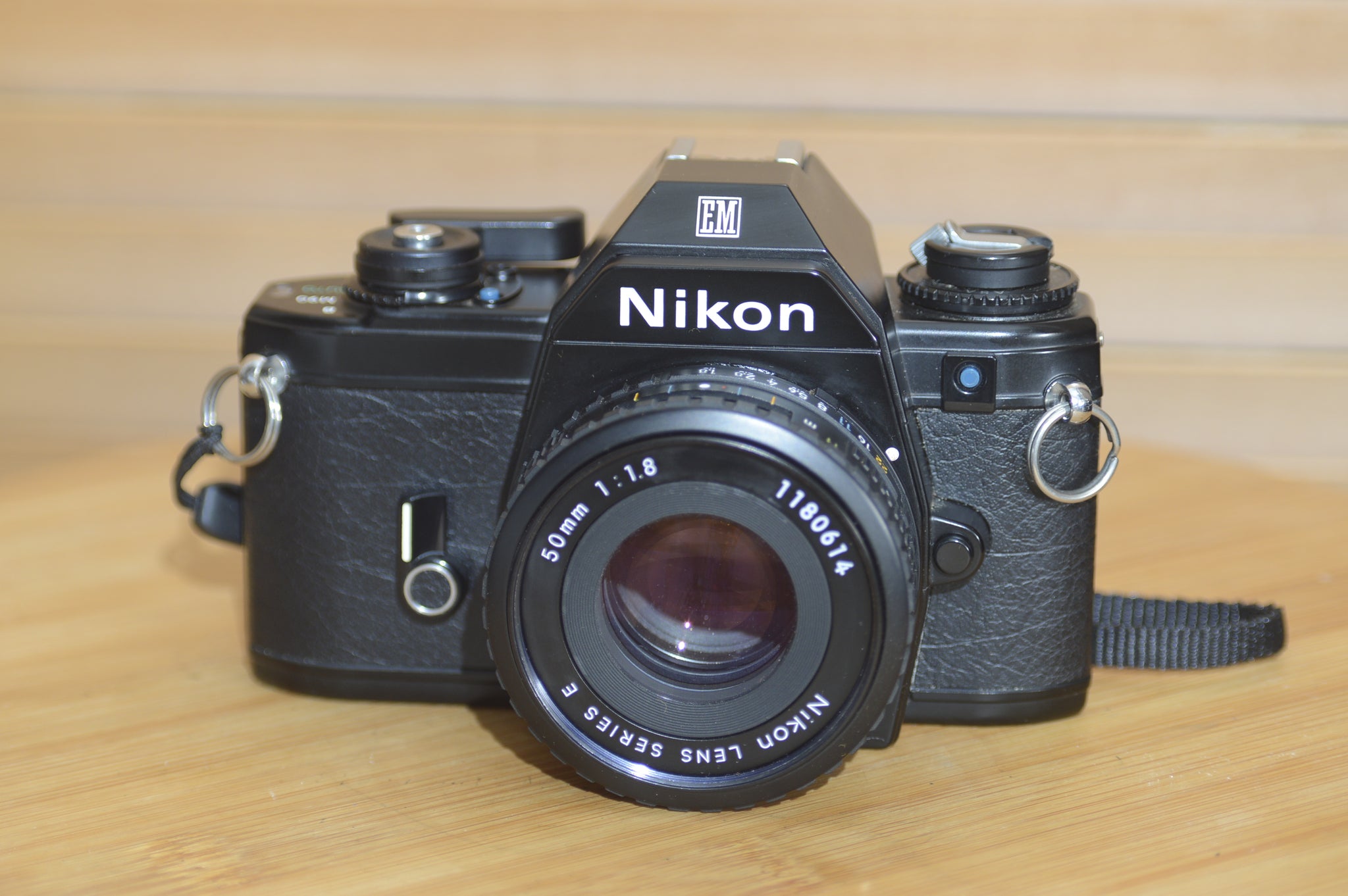 Beautiful Nikon EM 35mm Camera and 50mm f1.8 lens. Very stylish little vintage SLR.