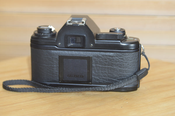 Beautiful Nikon EM 35mm Camera and 50mm f1.8 lens. Very stylish little vintage SLR.