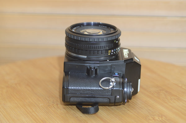 Beautiful Nikon EM 35mm Camera and 50mm f1.8 lens. Very stylish little vintage SLR.