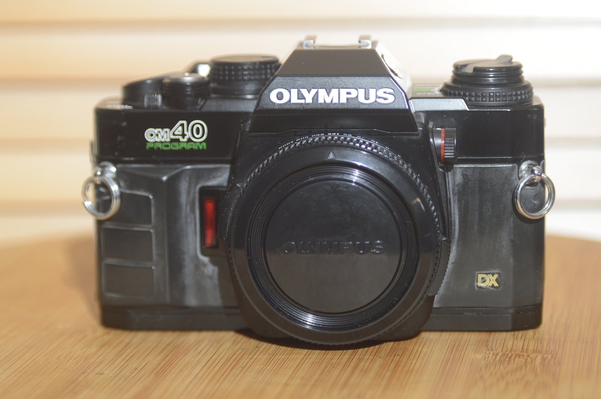 Black Olympus OM40 programme 35mm SLR (body only). Great condition. - Rewind Cameras 