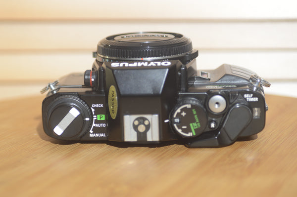 Black Olympus OM40 programme 35mm SLR (body only). Great condition. - Rewind Cameras 