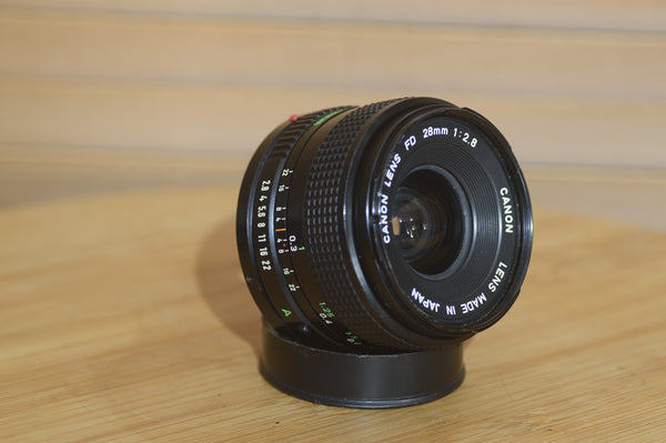 Vintage Canon FD 28mm f2.8 lens. This is a fantastic wide angle lens in great condition. - Rewind Cameras 