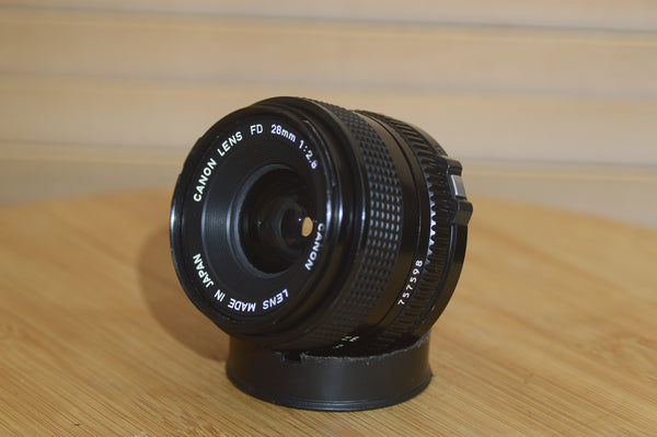 Vintage Canon FD 28mm f2.8 lens. This is a fantastic wide angle lens in great condition. - Rewind Cameras 