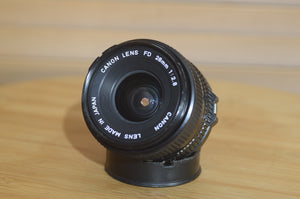 Vintage Canon FD 28mm f2.8 lens. This is a fantastic wide angle lens in great condition. - Rewind Cameras 