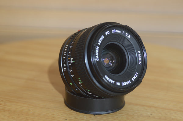 Vintage Canon FD 28mm f2.8 lens. This is a fantastic wide angle lens in great condition. - Rewind Cameras 