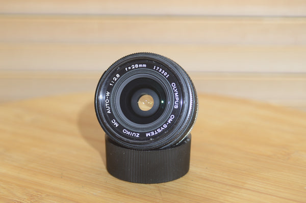 Gorgeous Olympus 28mm f2.8 Zuiko Lens. A perfect addition to your vintage Olympus set up.