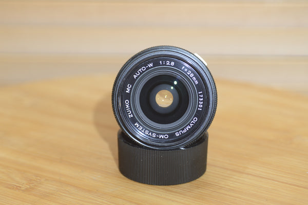 Gorgeous Olympus 28mm f2.8 Zuiko Lens. A perfect addition to your vintage Olympus set up.