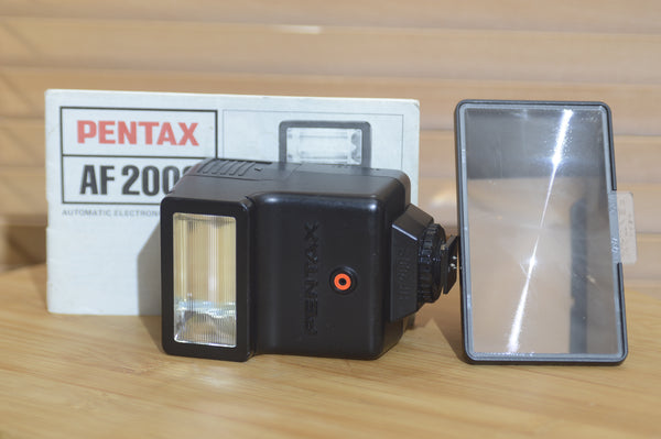 Asahi Pentax AF 200s Flash with Instruction Manual and Filter Hood. - Rewind Cameras 