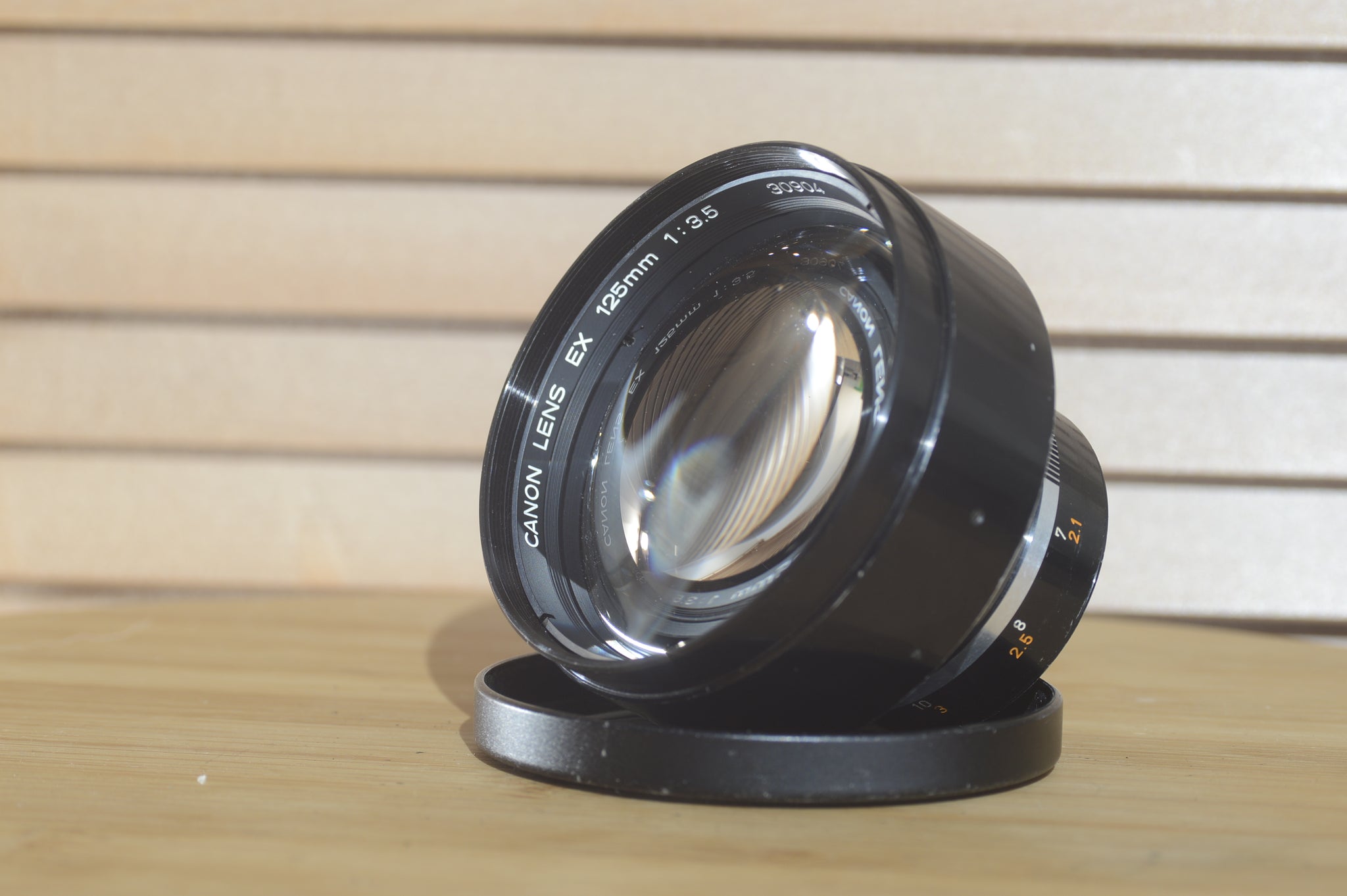 Gorgeous Canon EX 125mm f3.5 lens with case and lens hood. A fantastic addition to any photographers kit. A beautiful piece. - RewindCameras quality vintage cameras, fully tested and serviced