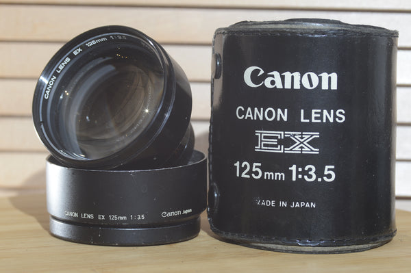 Gorgeous Canon EX 125mm f3.5 lens with case and lens hood. A fantastic addition to any photographers kit. A beautiful piece. - RewindCameras quality vintage cameras, fully tested and serviced