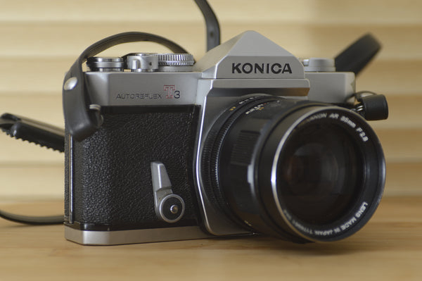 Konica AutoReflex T3 35mm SLR camera with 35mm f2.8 lens. These are very solid and striking vintage cameras. - RewindCameras quality vintage cameras, fully tested and serviced