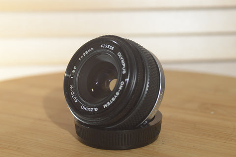 Gorgeous Olympus 28mm f3.5 Zuiko Lens. A perfect addition to your vintage Olympus set up. - RewindCameras quality vintage cameras, fully tested and serviced