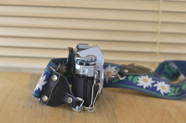 Beautiful Canon AE1 Body only with quirky flower strap the true design classic form Canon, now very collectable and you can see why ! - RewindCameras quality vintage cameras, fully tested and