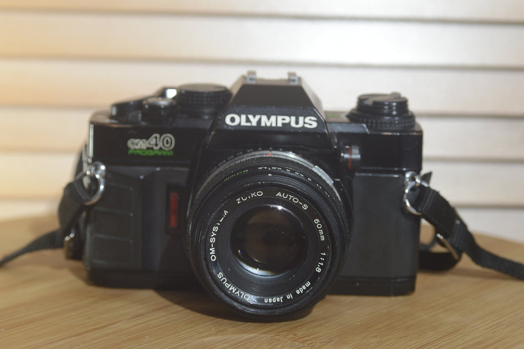 Rare Black Olympus OMPC SLR with Zuiko 50mm f1.8 lens. In